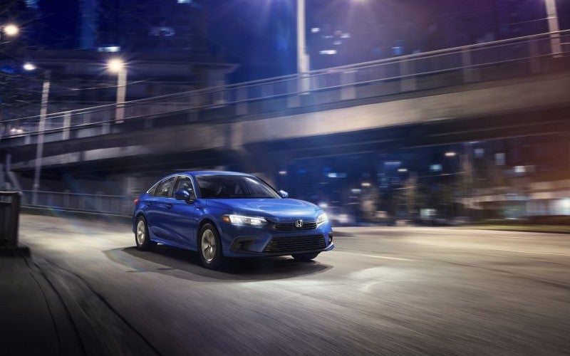 Honda Civic driving on highway at night