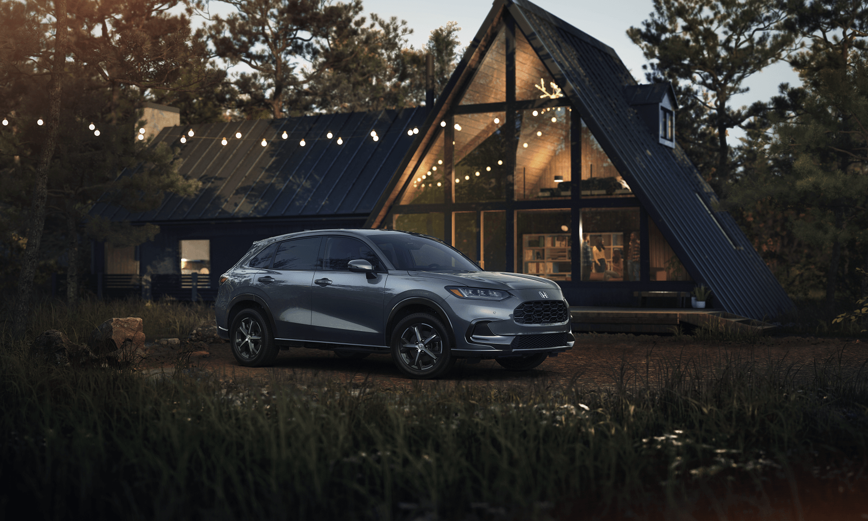 Honda SUV parked outisde mountain cabin