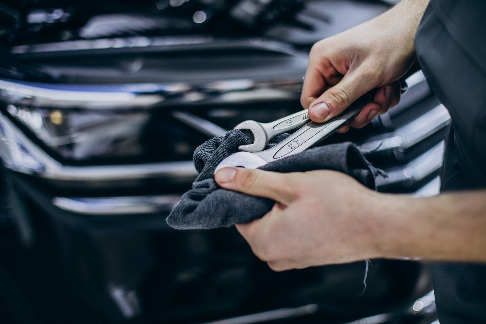 service technician cleaning his wrenches